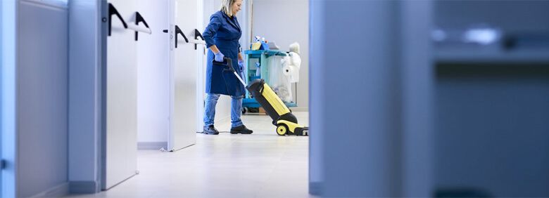 Woman vacuuming the floor